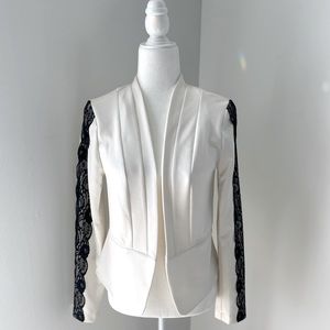 White Blazer with black lace trim on sleeves. ~ M